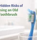 Find worn-out toothbrush with frayed bristles showing poor oral hygiene and replacement need.