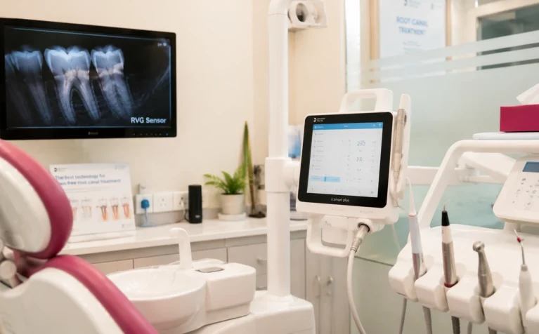 Dentist using modern digital equipment during a comfortable, pain-free root canal procedure